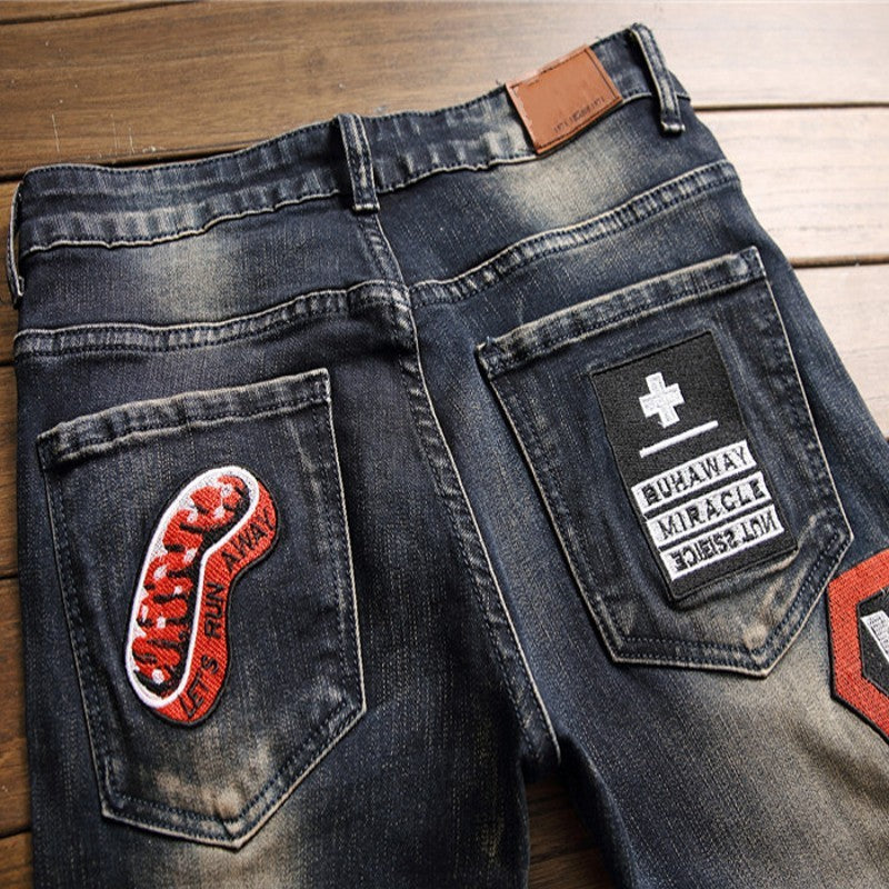 Men's Hip-Hop Badge Patchwork Design Ripped Fringe Skinny Jeans